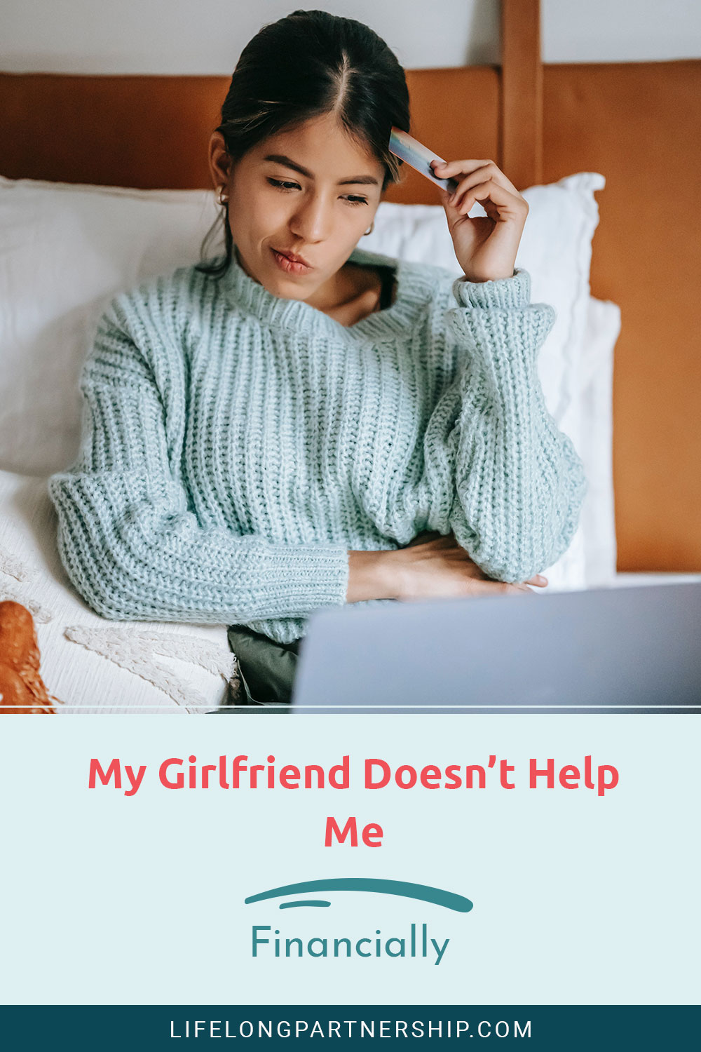 Woman with a credit card in hand and a laptop in front of her - My Girlfriend Doesn't Help Me Financially