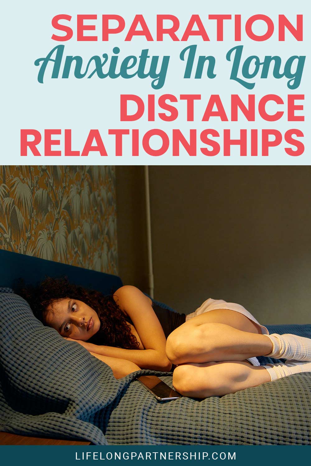 Worried girl lying on a bed - Separation Anxiety In Long Distance Relationships.