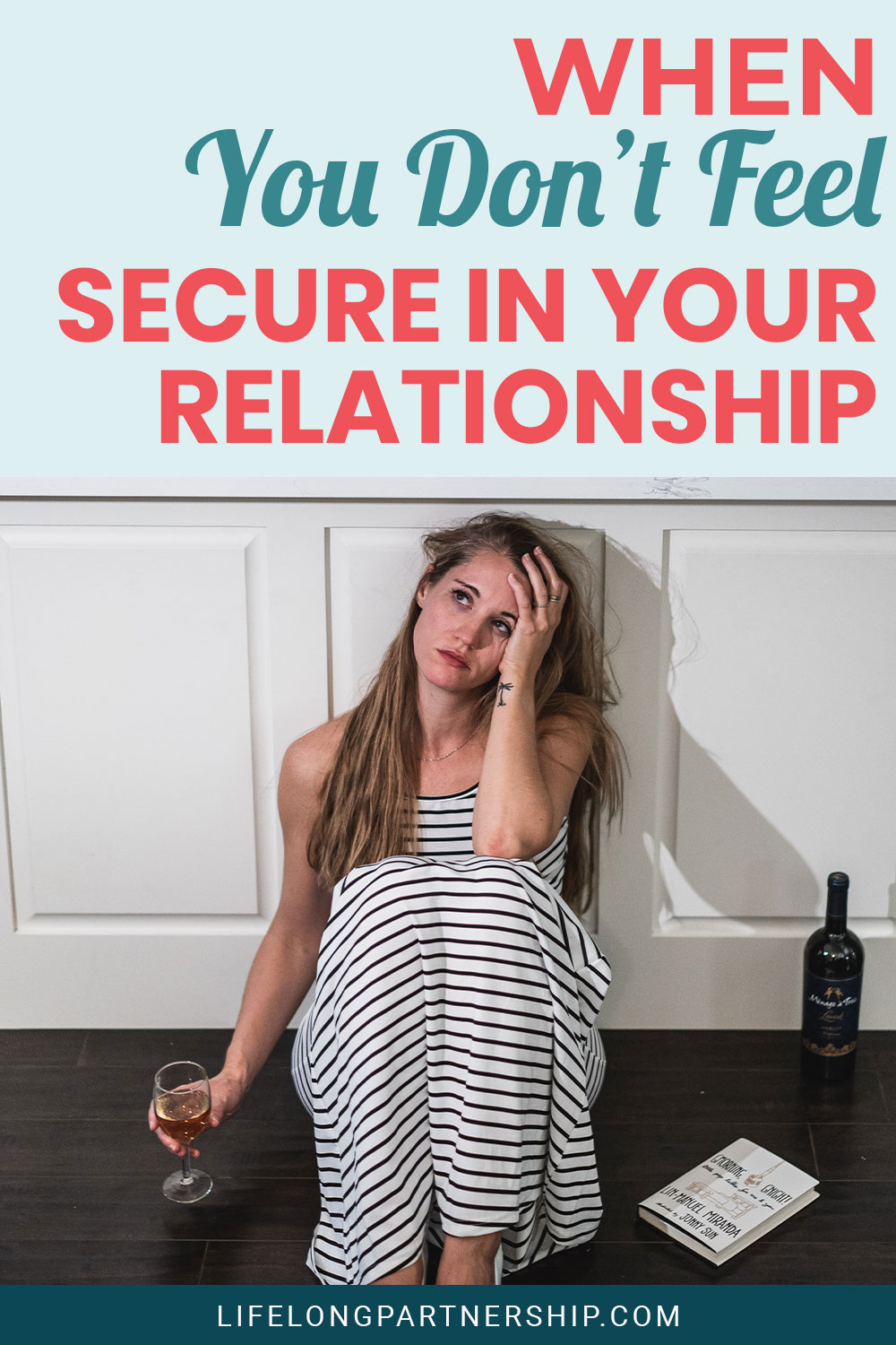 Sad woman sitting on the floor with a glass of wine in hand - When You Don’t Feel Secure In Your Relationship